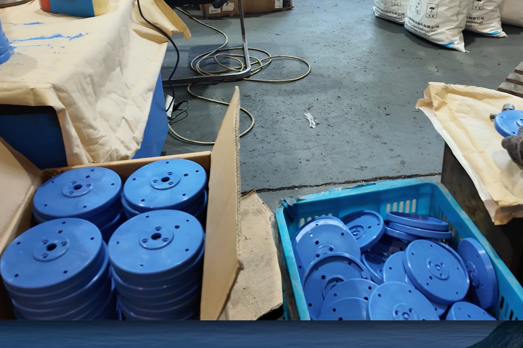 Blue molded plastic parts in production at the factory
